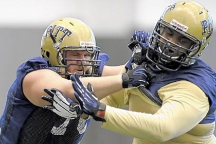 Pitt's Cory King, left, and Shane Johnson participate in spring football drills Tuesday afternoon on the South Side.