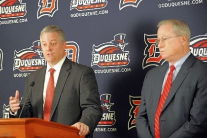 Duquesne athletic director Greg Amodio, left, will have to navigate the realignment uncertainty that surrounds college basketball.