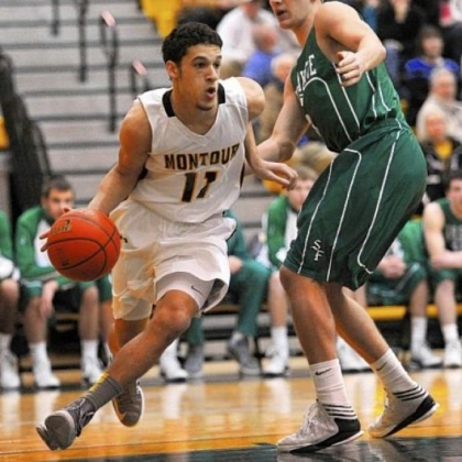 Montour Devin Wilson drives around South Fayette's Justin Watson in a PIAA Class AAA first-round game Friday night at North Allegheny.