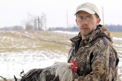 Joel Alsdorf with a chinchilla rooster.