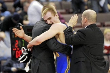 Canon-McMillan's Cody Wiercioch, center, celeberates his piece of history Saturday night in Hershey, Pa. with coach Chris Mary, right, and assistant Jason Cardillo, left.