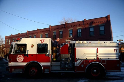 While responding to an early morning call for a pregnant woman going into labor, firefighter Bill Gilchrist runs through several checks on engine 17 on Friday, Jan. 18, 2013.