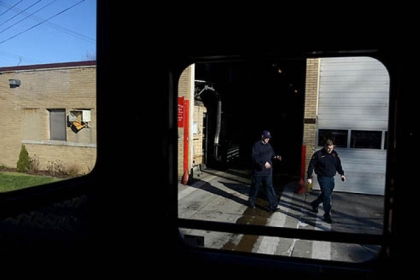 Firefighter Dan Reiser, left, and Lieutenant John Gardell exit Fire Station 17 in Homewood in order to make a trip to the grocery store for lunch on Friday, Jan. 18, 2013.