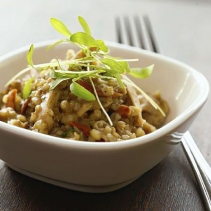 Zahav's Moroccan Chicken is served with chermoula (a spicy marinade), freekeh (a roasted grain) and pickled cabbage.
