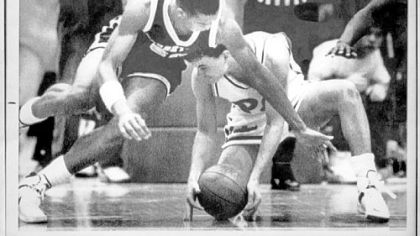 Pitt guard Sean Miller, right, grabs a loose ball from Georgetown's Sam Jefferson in a game Feb. 20, 1988 in Pittsburgh. Pitt defeated Georgetown, 70-65, in a game that was called off with 4 seconds on the clock because officials could not control the game.