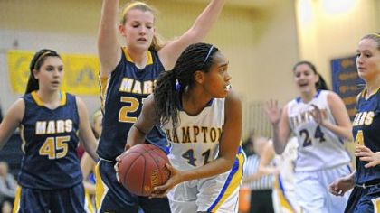 Hampton's Alexiss Griggs looks to pass as Mars' Ali Goetz defends Monday at Hampton. Hampton won, 46-24 to stay unbeaten in Class AAA Section 1.