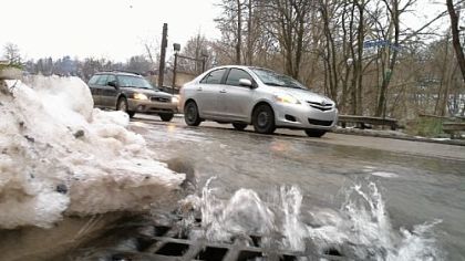 Water from a water main break drains from Route 51 at Midwood Avenue in Carrick.