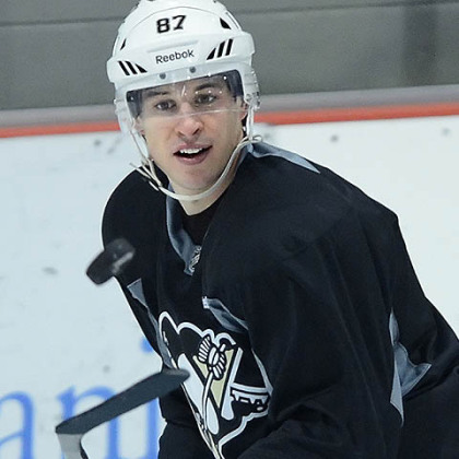 Pittsburgh Penguins' captain Sidney Crosby eyes up the puck during workouts today at the team's practice facility in Southpointe.
