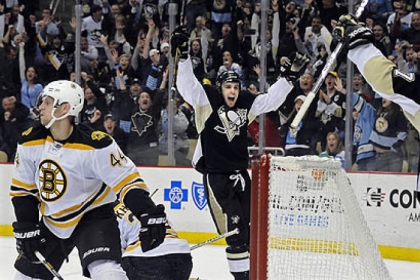 The Penguins' Brandon Sutter celebrates his winning goal against the Bruins in the third period at Consol Energy Center.