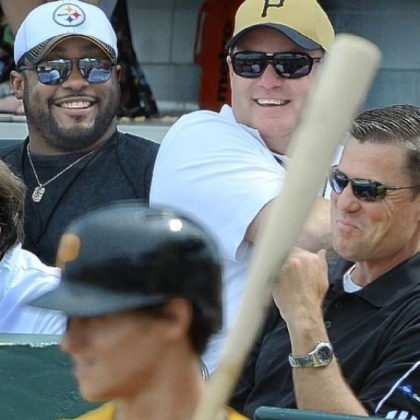 Steelers coach Mike Tomlin and general manager Kevin Colbert joke with Pirates president Frank Coonelly at a Pirates exhibition game at McKechnie Field in Bradenton, Fla.