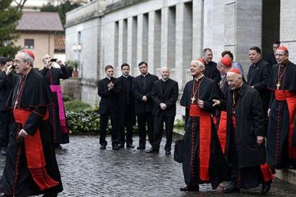 From left, U.S. Cardinals Justin Francis Rigali, Donald Wuerl, Timothy Dolan, Francis George and Roger Mahony leave the North American College on Tuesday morning. They were going to the Vatican's Domus Sanctae Martae, the Vatican hotel where the cardinals stay during the conclave.