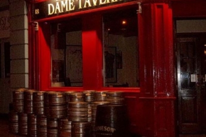 At closing time in Dublin's touristy Temple Bar region, a day's worth of empty kegs are piled outside a pub.