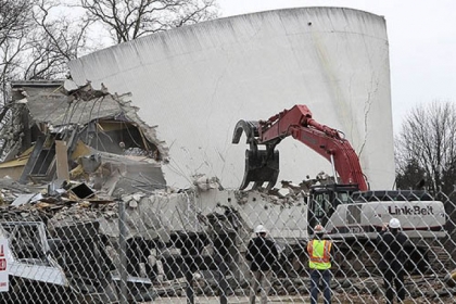 Demolition of the Gettysburg Cyclorama building continues Monday in Gettysburg, Pa. Contractors are being careful not to damage the historical trees in the area during the demolition.