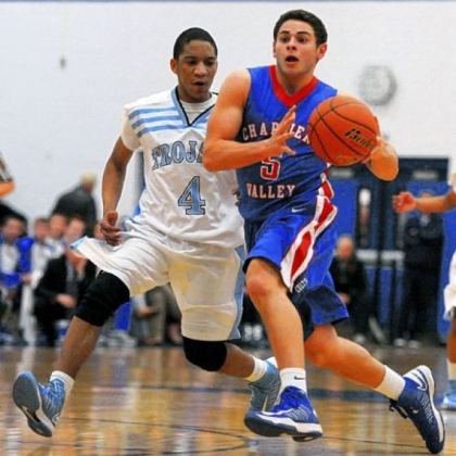 Johnstown Damean Barfield, left, guards Chartiers Valley's Michael Boulos on a drive in first half action.