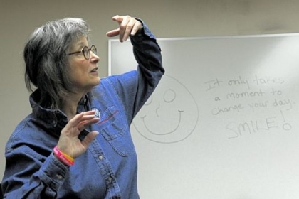 Julie Ann Sullivan during a laughter workshop last month at the Volunteers of America office in Sharpsburg: "It is phenomenal to teach people to create their own true, mirthful laughter."