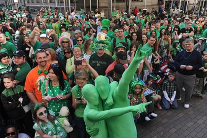 Spectators get their green on at last year's St. Patrick's Day Parade Downtown.