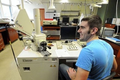 Chemistry major Dave Tiberi, a senior, in the chemistry instrument laboratory, which features a scanning electron microscope, left.