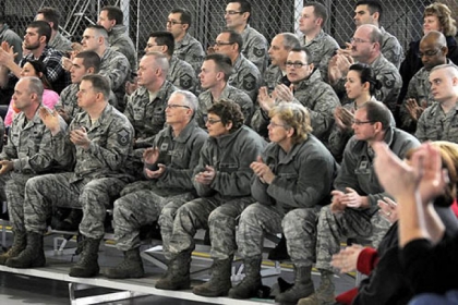 911th Airlift base personnel applaud after Col. Craig C. Peters, the 911th Airlift Wing commander, announced that the base will stay open.