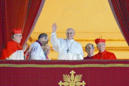 Argentina's Cardinal Jorge Bergoglio, who took the name Pope Francis, waves Wednesday from the papal balcony of St. Peter's Basilica at the Vatican after being elected the Roman Catholic Church's 266th pope.