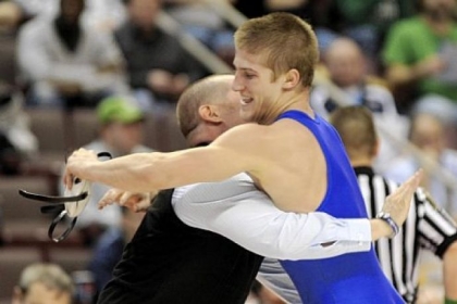 Canon-McMillan's Connor Schram, right, hugs his coach, Chris Mary, after defeating Franklin Regional's Michael Kemmerer in PIAA Class AAA 126-pound final last Saturday in Hershey, Pa.