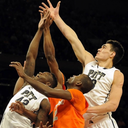 Pitt's Talib Zanna and Steven Adams reach for a rebound against Syracuse' Baye Moussa Keita in the first half of the Big East Championship quarterfinals at Madison Square Garden today. Pitt lost, 62-59.