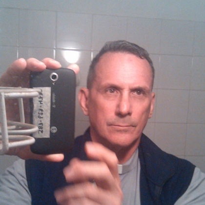 The Rev. Vincent Capuano, a Jesuit priest who is a native of Brookline, takes a photo of himself in Argentina.