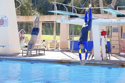 Coach Greg Louganis, left, schools former NBA great Kareem Abdul-Jabbar in the fine art of diving in the new reality show "Splash," premiering Tuesday on ABC.