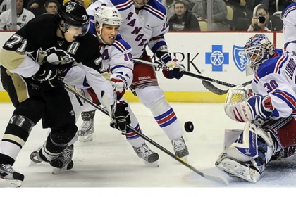 Penguins center Evgeni Malkin tries to get a shot on Rangers goaltender Henrik Lundqvist.