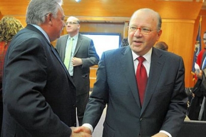 Carnegie Mellon University president Jared Cohon, the chair of the Regionalization Evaluation Review Panel, shakes the hands of panel members as he leaves a news conference Friday.