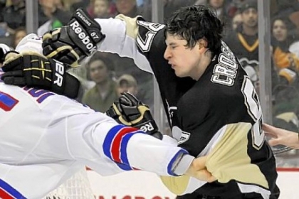 Sidney Crosby can get the Penguins going in a variety of ways. Saturday, he took on the Rangers' Dan Girardi behind the net. Both were sent to the penalty box.