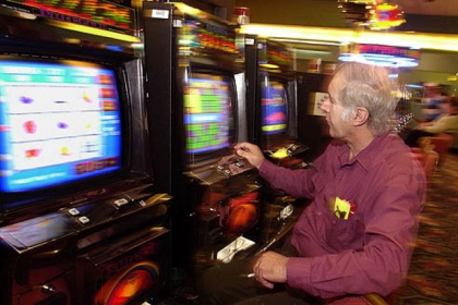 Playing a video keno machine in Palm Springs, Calif.