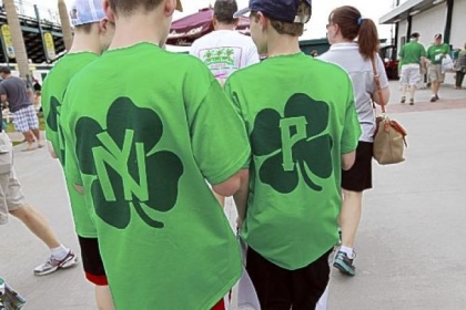 Josh Goldberg, 12, left, and Jake Harman, 12, of Kansas City, sport St. Patrick's Day-themed Yankees and Pirates shirts Sunday in Bradenton, Fla.