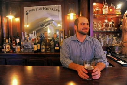 Brad Palmisiano hosts guests at his third story custom built bar called Upper Pius Men's Club.