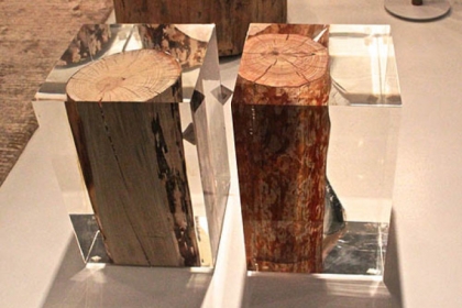 Four Hands acrylic and log pedestal.
