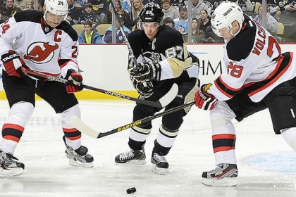 The Penguins' Sidney Crosby splits the Devils defense in the first period against New Jersey Feb. 2 at the Consol Energy Center.