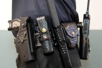 A typical Pittsburgh Police officer's belt. From left: Taser, pepper spray, collapsable baton, handcuffs, radio. Located on the other side: handcuffs .40 cal Glock automatic pistol, extra ammunition, rubber gloves and CPR mask. Missing is a flashlight. The items are arranged by the officer for their convenience.