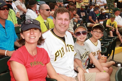 From left, Suzanne and Neil Alexander enjoy a Pirates spring training game with their daughter Abby, 11, and son Patrick, 9, at McKechnie Field in Bradenton, Fla.