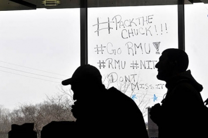 Slogans are painted on the windows of the Nicholson Center at Robert Morris University.