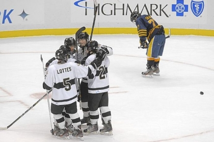 Quaker Valley players including Otto Schaefer, 18, center, celebrate after scoring in the second period in the PIHL Class A game against Mars.