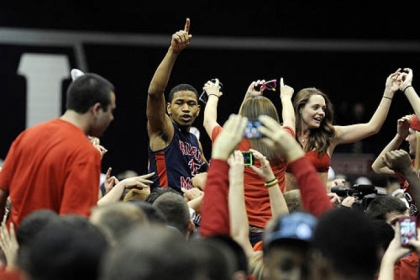Robert Morris guard Karvel Anderson (15) celebrates with fans following the huge 59-57 win against Kentucky.