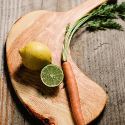 Pittsburgh-made cutting board by Chris Bandy with veggies on it.