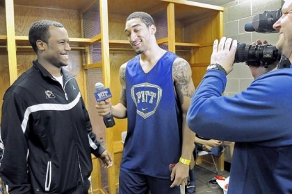Pitt guard Cameron Wright turns the microphone on assistant coach Brandin Knight in the locker room as the Panthers prepare for their NCAA second-round game against Wichita State.