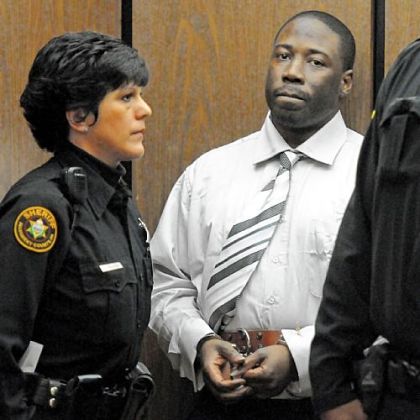 Ronald Robinson is escorted from Judge Kevin Sasinoski's courtroom for a lunch recess on the first day of his murder trial Thursday.