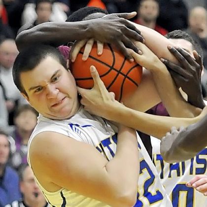 West Mifflin's Michael Peterson fights for a rebound against Steel Valley Tuesday night in a WPIAL Class AAA Section 4 game.