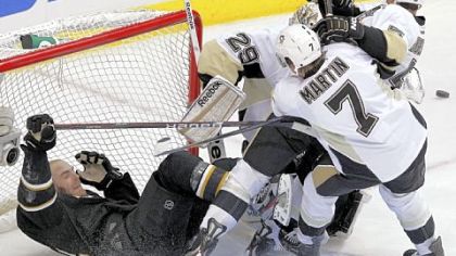 Paul Martin knocks Dallas Stars left wing Eric Nystrom into the net during a game in Dallas on Feb. 29.