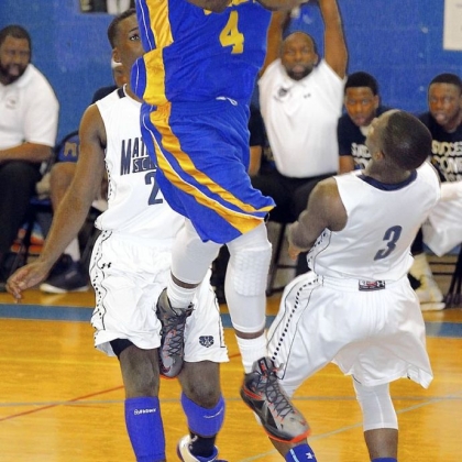 Vaux's Amir Butler drives to the basket against Math, Civics & Sciences in the first quarter of a PIAA Class A semifinal Tuesday.