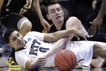 Pitt's James Robinson and Wichita State's Jake White go after a loose ball during this afternoon's NCAA tournament game in Salt Lake City. Pitt lost 73-55.