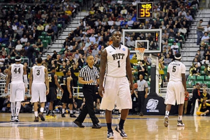 Pitt's Tray Woodall walks off the floor after fouling out against Wichita State in the second half of the second round of the NCAA tournament at Energy Solutions Arena.