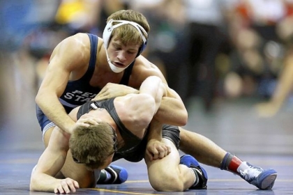 Penn State's David Taylor, top, controls North Carolina's John Staudenmayer during their 165-pound match at the NCAA Division I wrestling championships in Des Moines, Iowa.