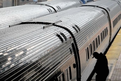 A man boards the Pennsylvanian in February. The Amtrak passenger train runs between Pittsburgh and Harrisburg and continues to Philadelphia and New York City.